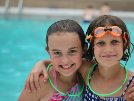 Campers swimming at the pool.